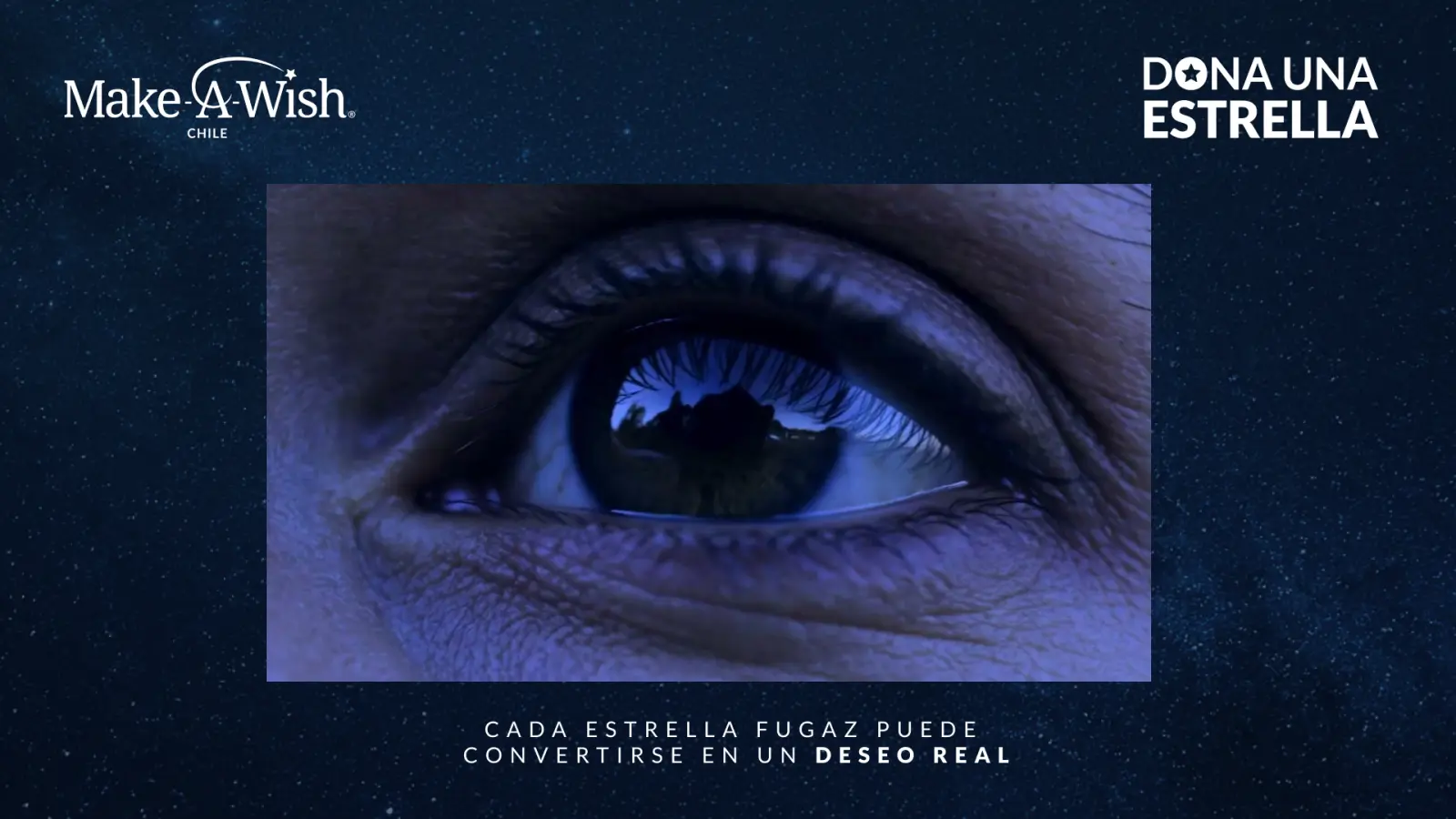 Pieza visual de Make-A-Wish con un ojo mirando un cielo nocturno y el concepto Dona una estrella