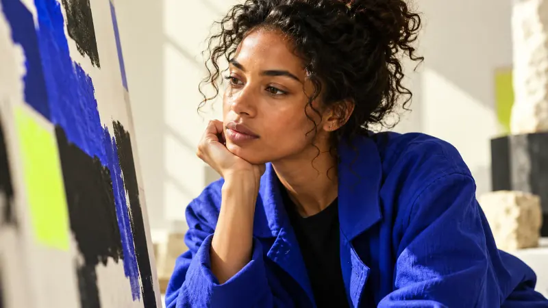 Conceptual editorial image: a portrait of a professional examining a proposal.